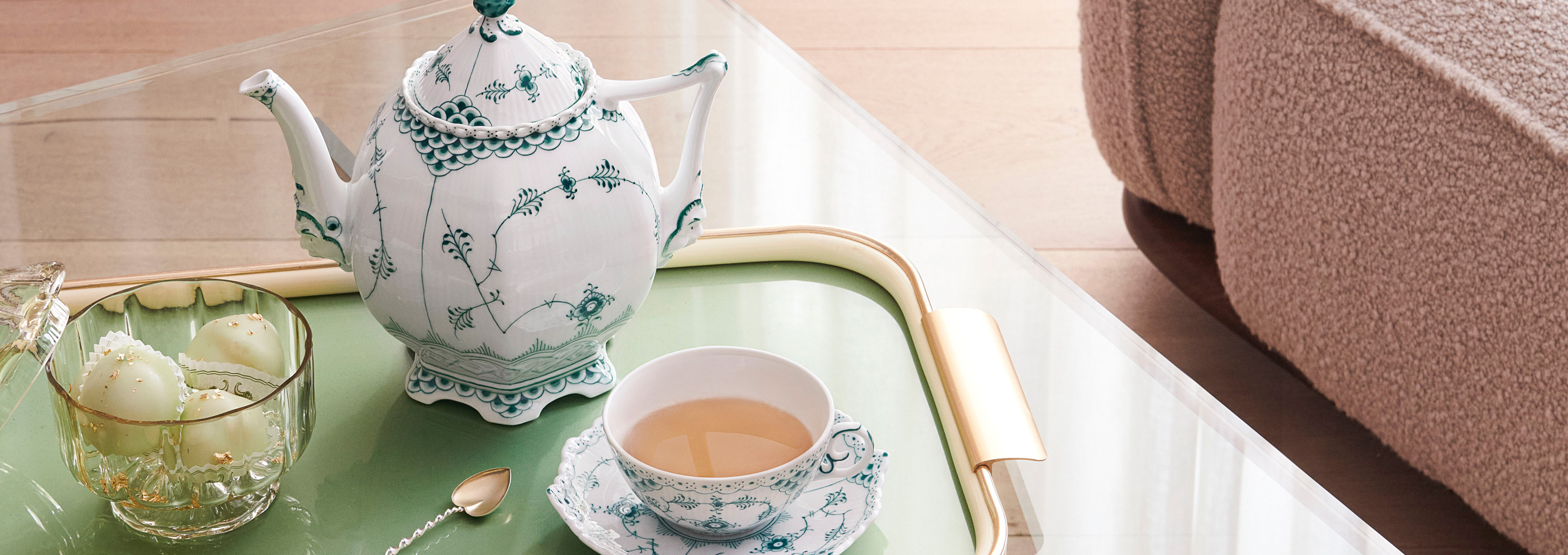 The handcrafted and hand-painted Emerald Green Fluted Full Lace teacup and teapot